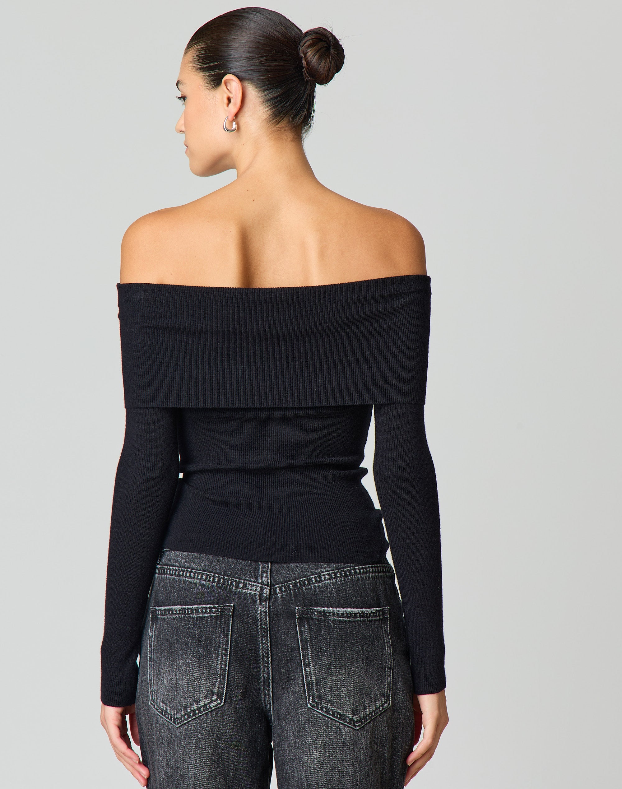 black shoulderless top