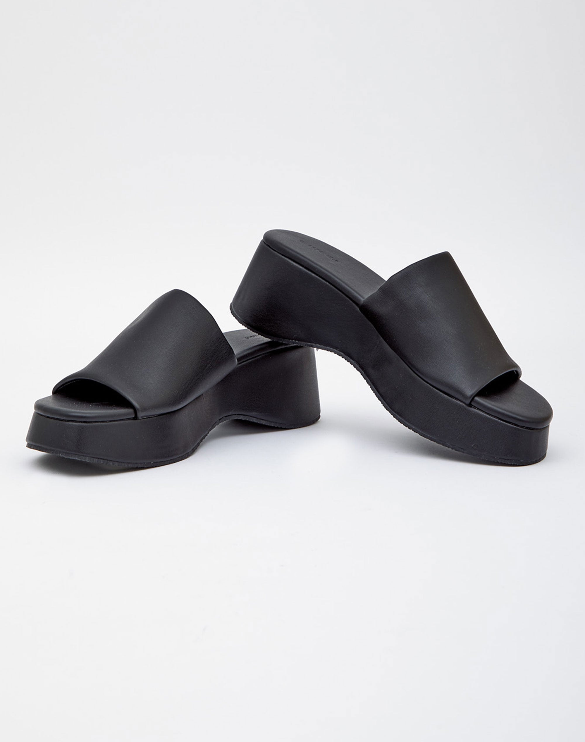 black leather platform slip ons