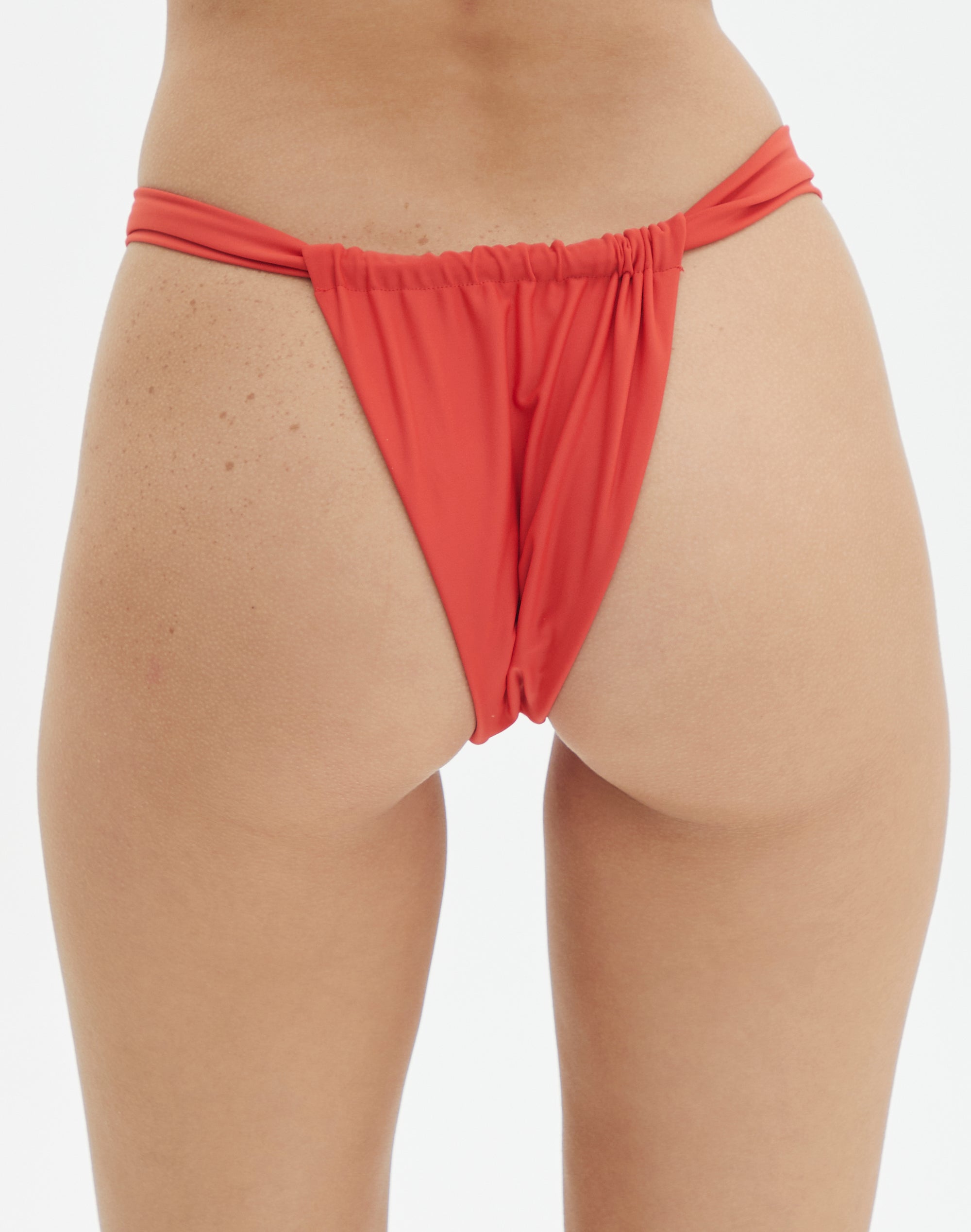 Ruched Cheeky Bikini Bottom in Left On Red